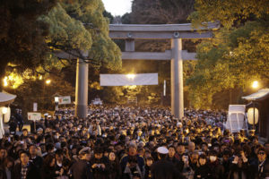 Crowds wait their turn to offer prayers at the Meiji Shrine in Tokyo, on the second day of the new year Saturday, Jan. 2, 2010. (AP Photo/Greg Baker)
